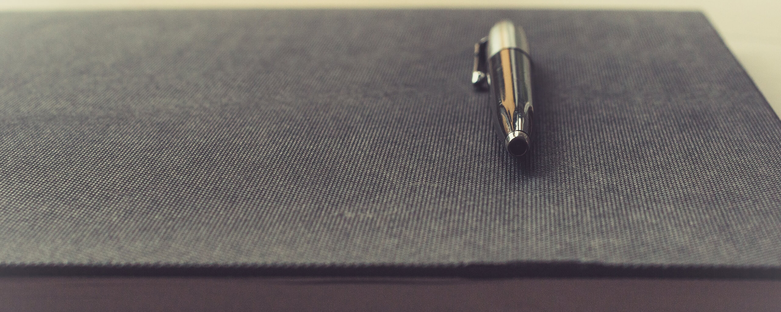 pen over a notebook