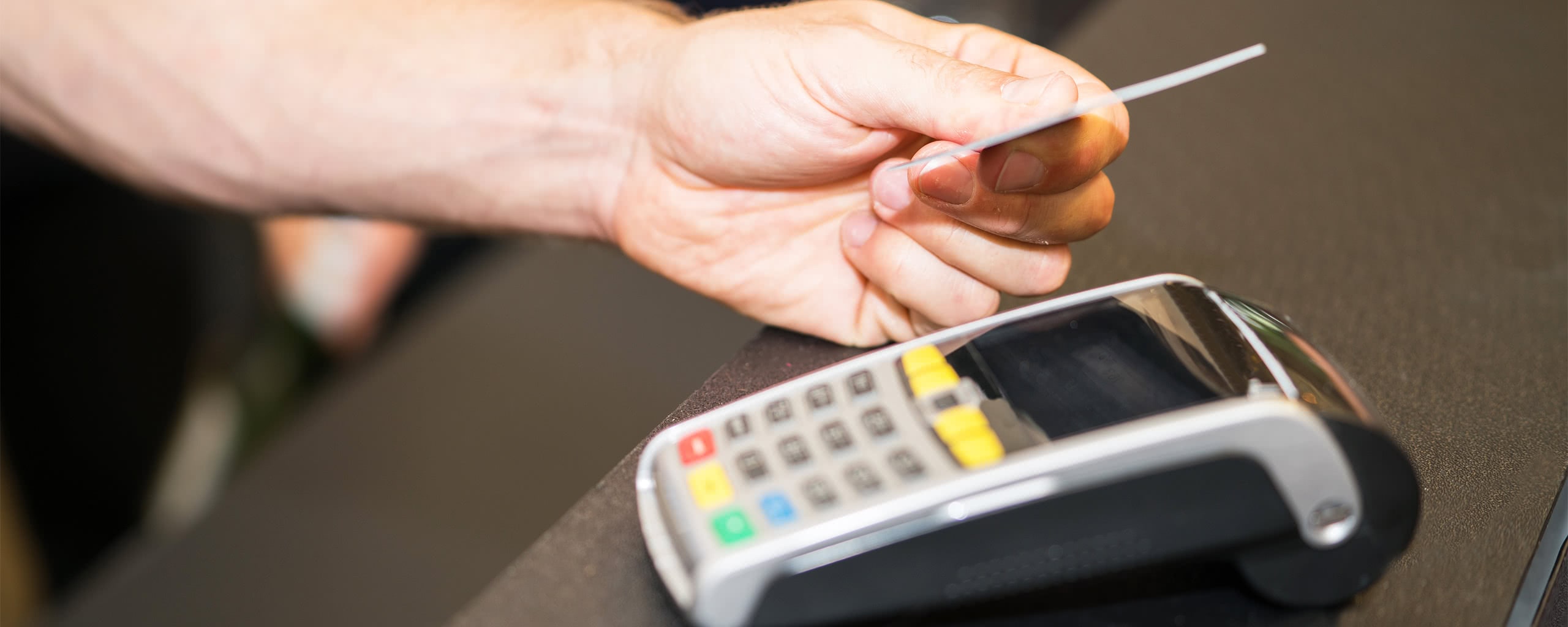 paying with a card on a POS terminal