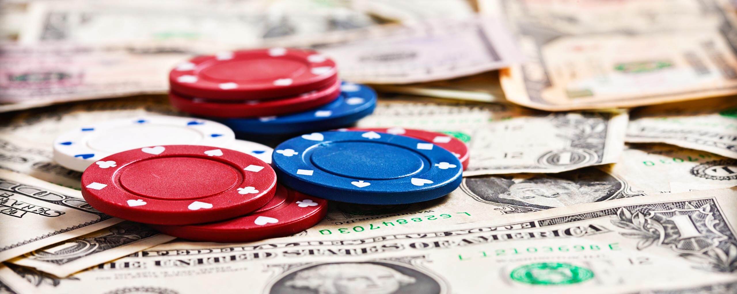 Gambling chips on dollar banknotes