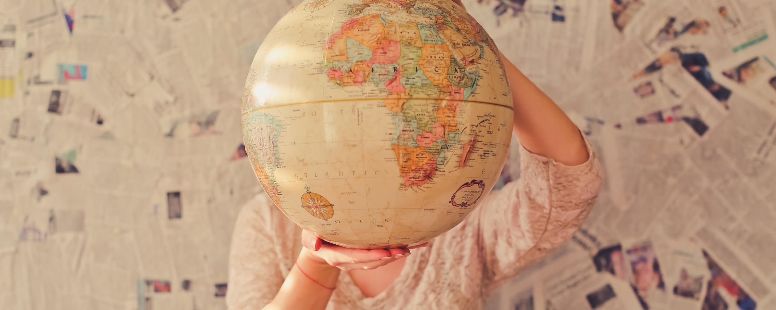 Woman holding cryptocurrency globe