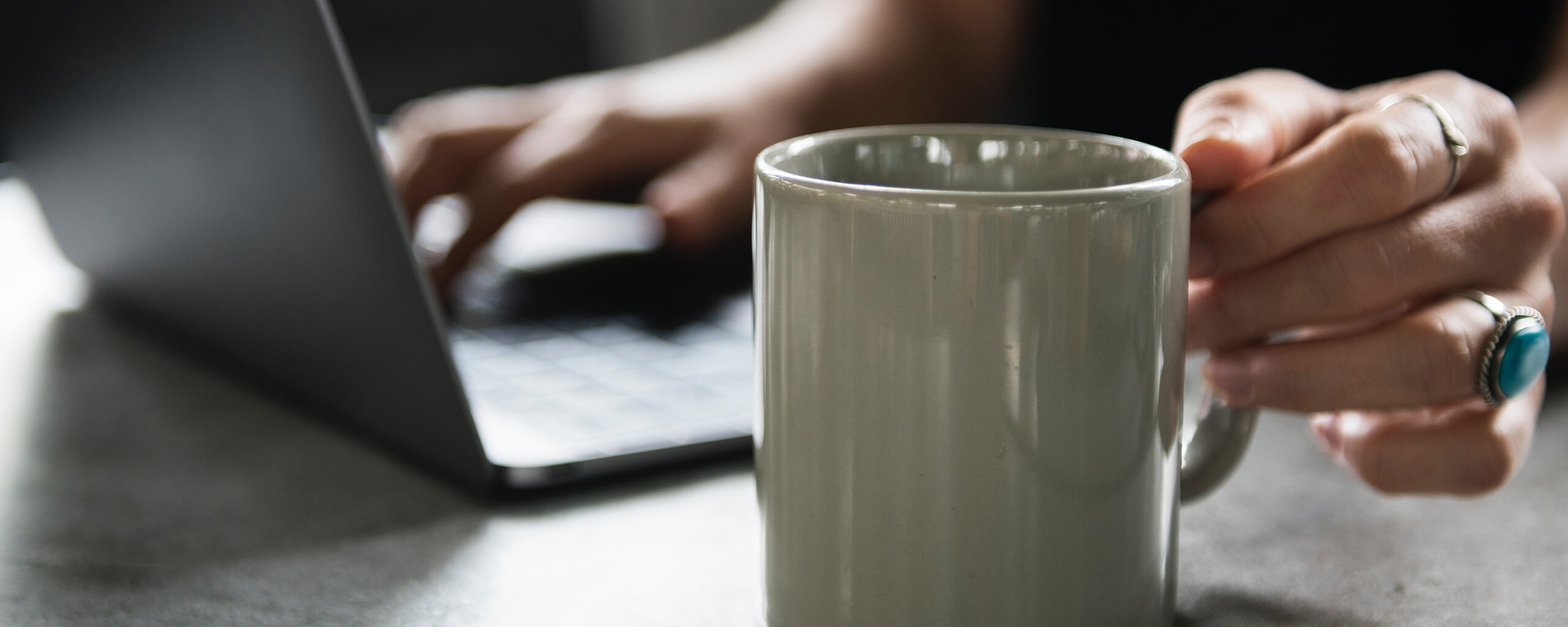 laptop and a coffee mug