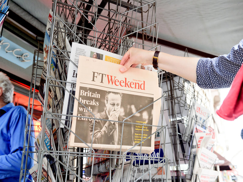 person buying the newspaper FT Weekend