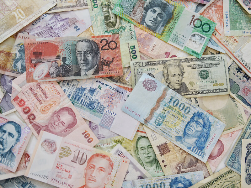 Background filled with different currencies