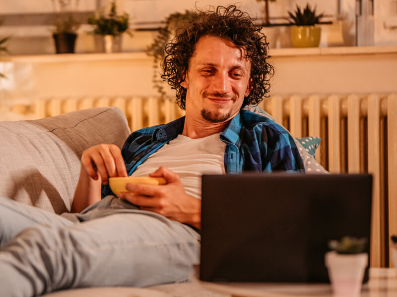 sports fan on their laptop as though deciding how to be strategically