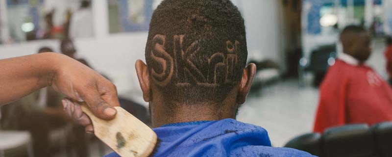 man with Skrill logo inscribed on his head