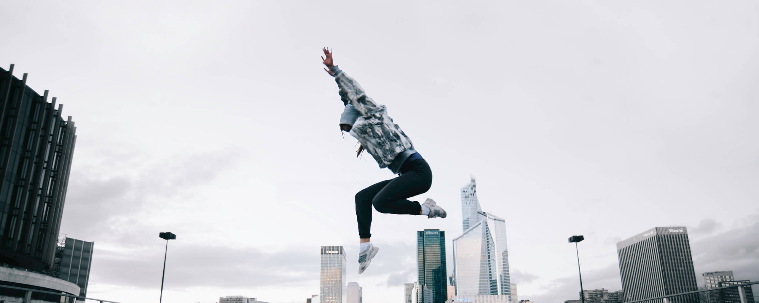 girl jumping on a city background