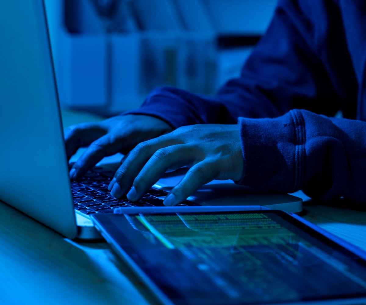 hacker in front of a laptop